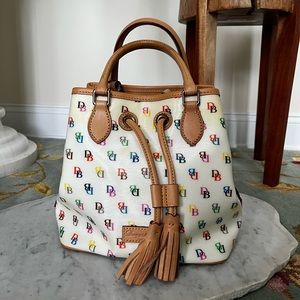 Never been used Dooney & Bourke handbag with removable cross body strap.